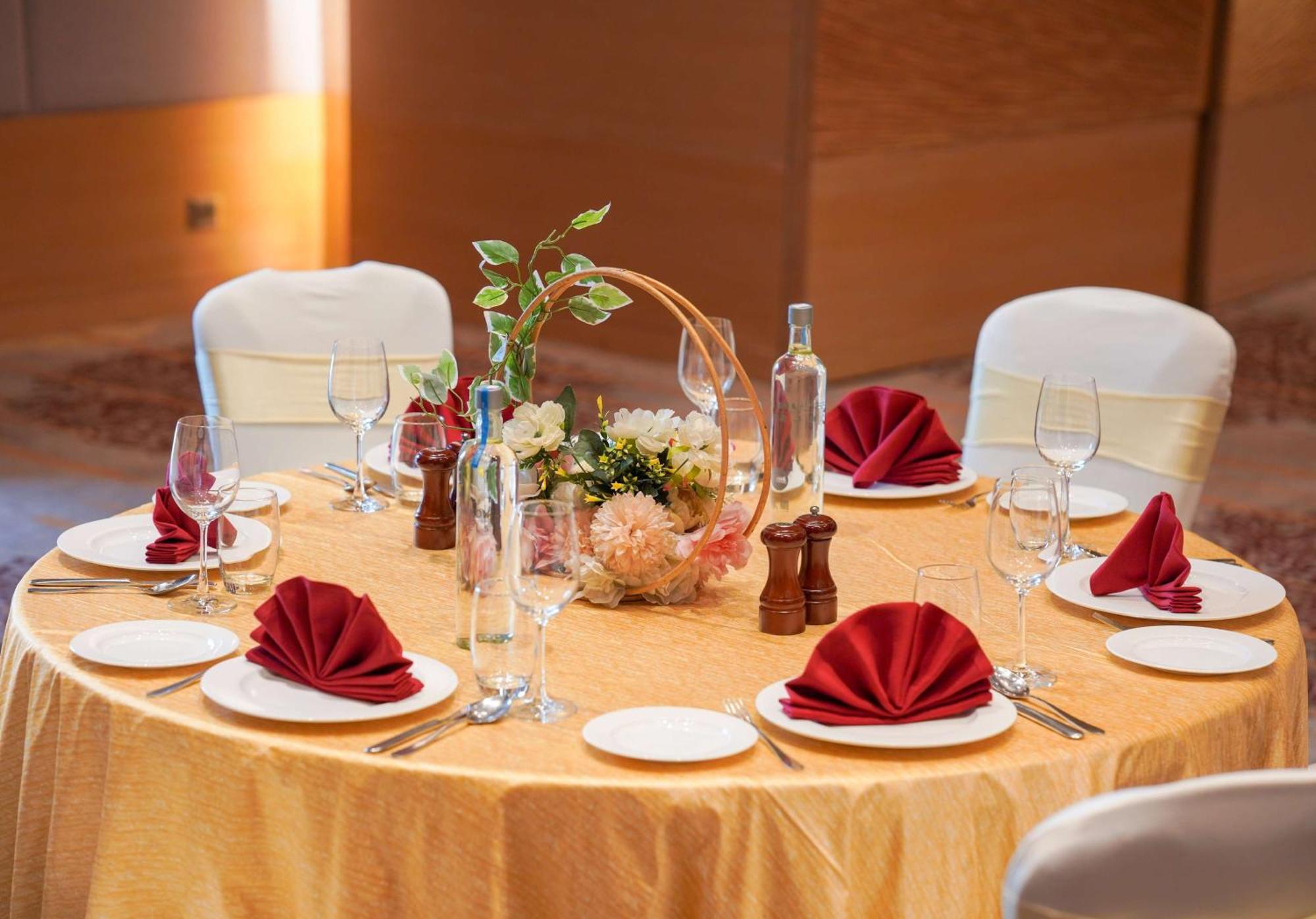 Radisson Blu Hotel Amritsar Bagian luar foto A table set for a formal dinner